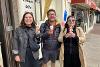 People holding ice creams on a trip to Southport